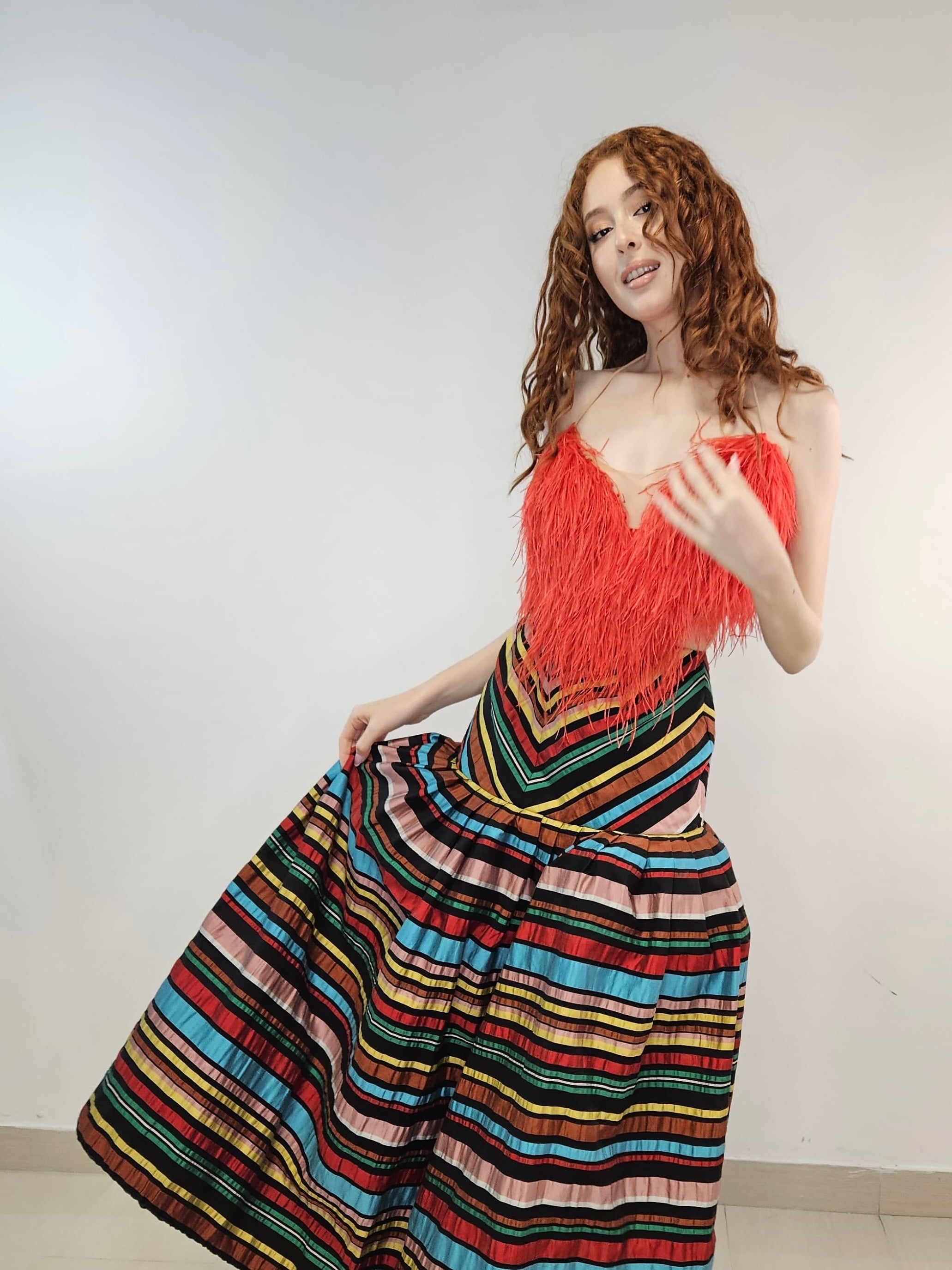 Empire silhouette skirt, high-waisted silk skirt, bell-shaped skirt, multi-colored striped skirt, raw silk skirt, elegant statement skirt, voluminous skirt, classy striped skirt, bold design skirt, luxurious silk skirt