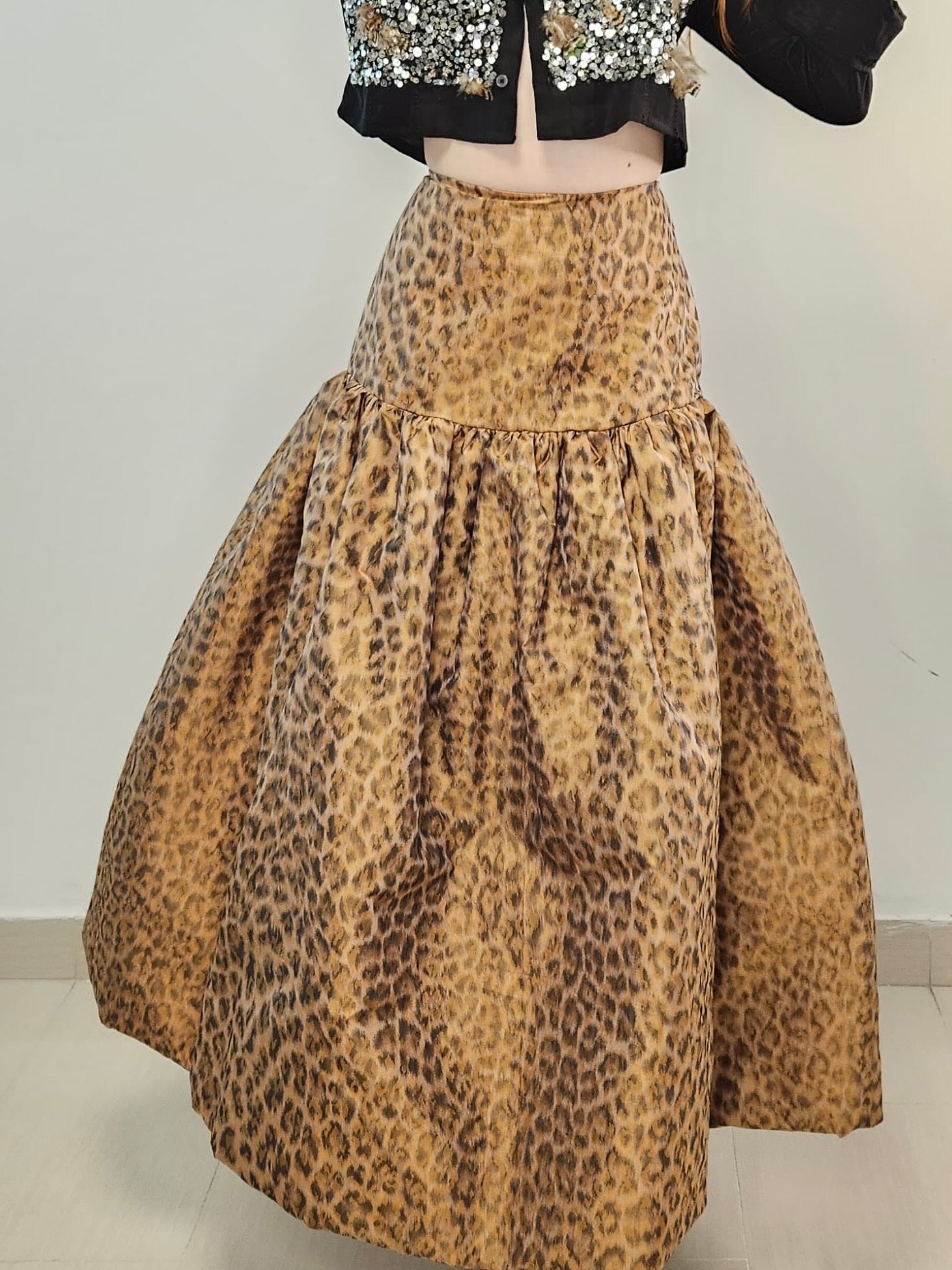 Empire silhouette dress, animal print raw silk, high-waisted dress, fitted bodice dress, voluminous skirt, luxurious raw silk dress, flattering dress, bold animal print dress, sophisticated style, elegant dress